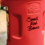 red plastic container with words "small red beans" on side