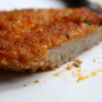 Piece of chicken coated in homemade Shake ‘n Bake
