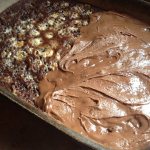Pan of Southern Cola Cake half frosted