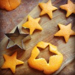 Orange stars on cutting board with star shaped cookie cutter off to one side