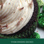 Partial view of Irish cream cupcake with chocolate shavings sprinkled on top