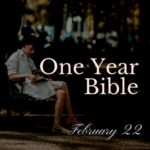 Woman on park bench reading her Bible