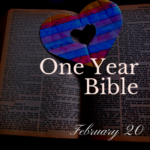 Picture of a red and blue paper heart sitting on an open Bible