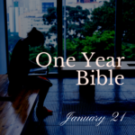Woman on a bench in a building reading her Bible