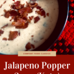 Bowl of jalapeño popper soup on red and black checkered cloth