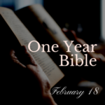 Hands holding an open Bible