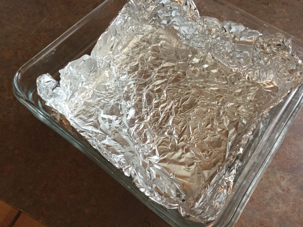 An 8x8 square pan lined with foil