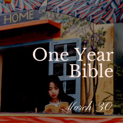 Woman sitting out on a veranda reading a Bible