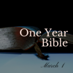An open Bible with a bookmark lying in the center