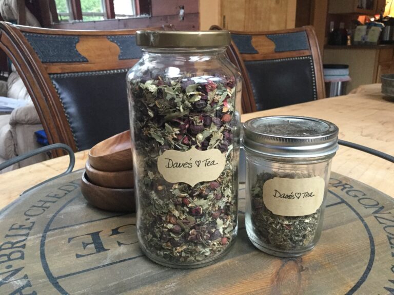 Two jars of an herbal blend sitting on a table
