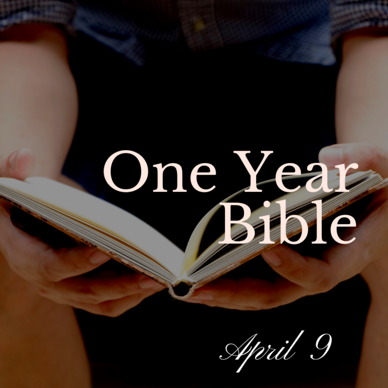 A man holding an open Bible in his lap