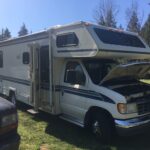 A 25 foot RV sitting on grass